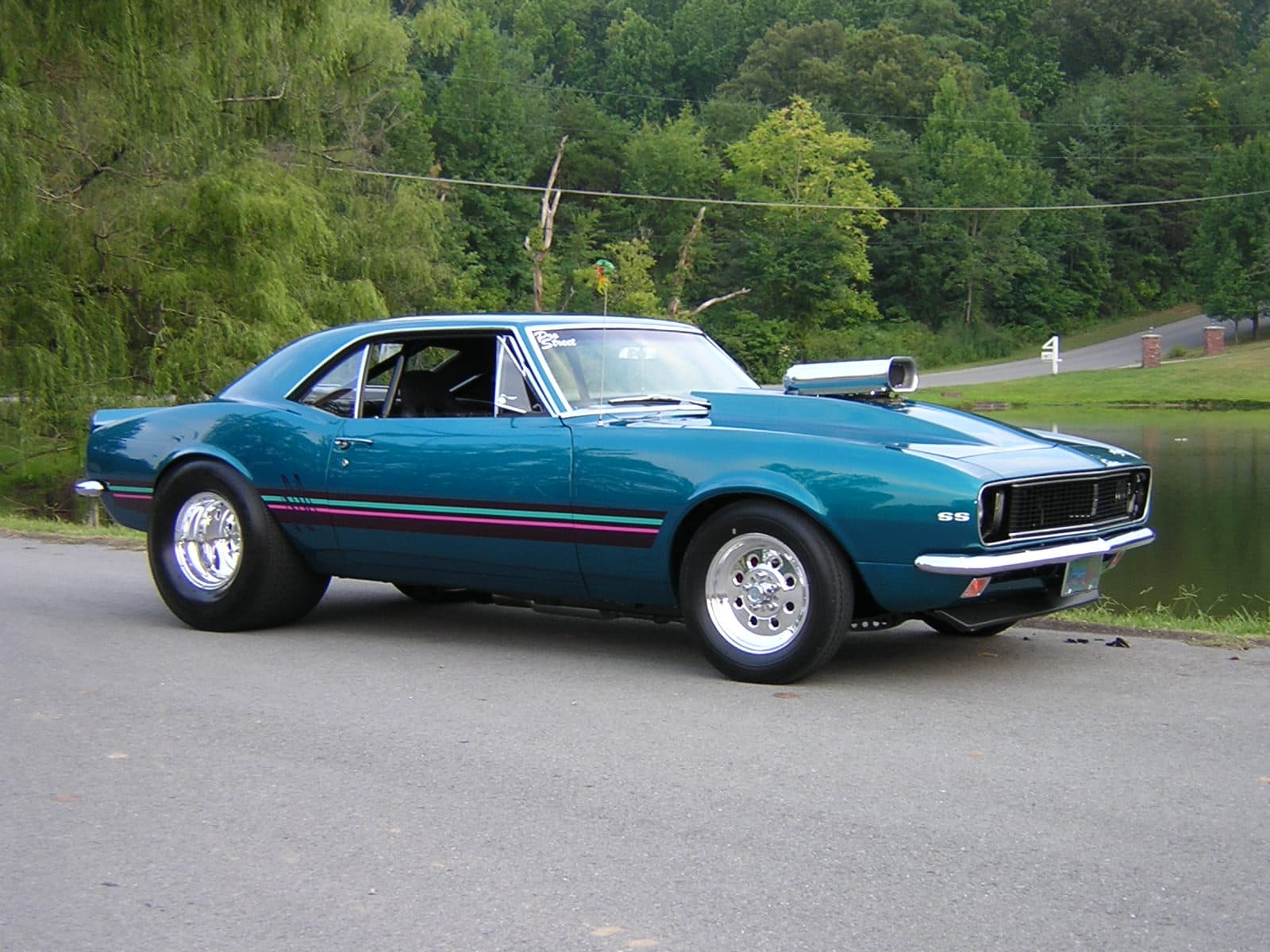 The organizer's teal Camaro SS pro-street car